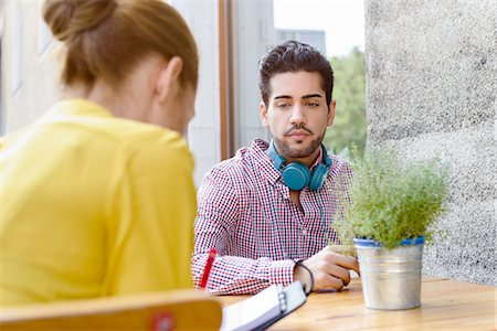 Young couple at sidewalk cafe table Stock Photo - Premium Royalty-Free, Code: 649-08144886