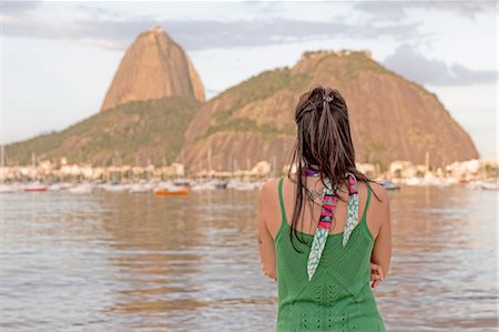 simsearch:649-08085699,k - Mid adult woman looking out towards Sugarloaf mountain, Botafogo bay, Rio de Janeiro, Brazil Stock Photo - Premium Royalty-Free, Code: 649-08144967