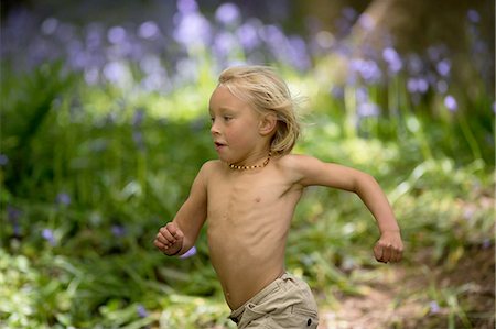 forest boy - Young boy running through bluebell forest Stock Photo - Premium Royalty-Free, Code: 649-08145251