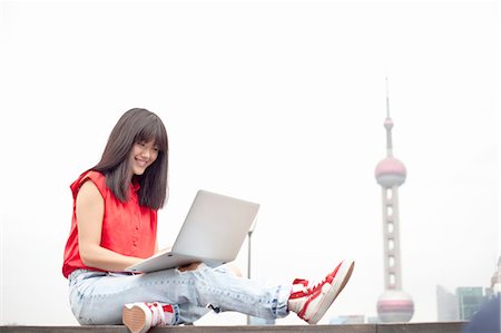 simsearch:649-08145347,k - Young woman using laptop, outdoors, Shanghai, China Stock Photo - Premium Royalty-Free, Code: 649-08145358