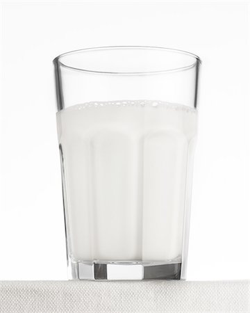 photos glass of milk - Close up of drinking glass of frothy effervescent water Stock Photo - Premium Royalty-Free, Code: 649-08145589