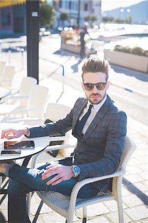 simsearch:649-08180080,k - Portrait of stylish young businessman at sidewalk cafe Stock Photo - Premium Royalty-Free, Code: 649-08180066