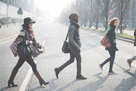 simsearch:6113-07542497,k - Four young adults crossing city road Photographie de stock - Premium Libres de Droits, Code: 649-08180161