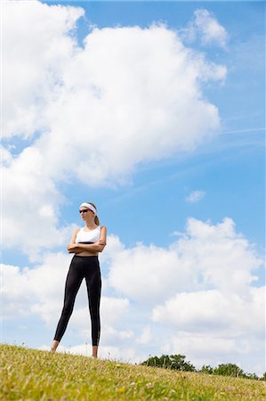 simsearch:649-09207442,k - Portrait of jogger against blue skies of countryside Stock Photo - Premium Royalty-Free, Code: 649-08180199