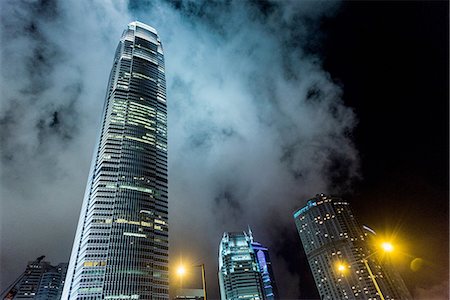 dramatizing - Skyscrapers at night, low angle view, Hong Kong, China Stock Photo - Premium Royalty-Free, Code: 649-08180325