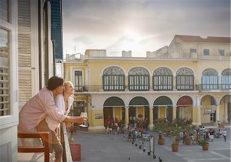 plaza vieja - Romantic young couple looking out from restaurant balcony in Plaza Vieja, Havana, Cuba Stock Photo - Premium Royalty-Free, Code: 649-08180382