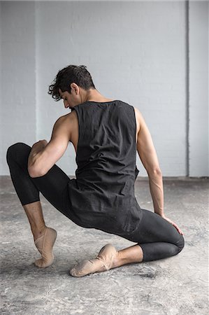 picture of a dancer in black color - Dancer practising in studio Stock Photo - Premium Royalty-Free, Code: 649-08180619