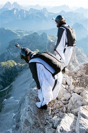 skydiving people - Two male BASE jumpers preparing to launch from mountain, Dolomites, Italy Foto de stock - Sin royalties Premium, Código: 649-08180694