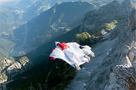 simsearch:649-08715007,k - Two male BASE jumpers wingsuit flying from mountain, Dolomites, Italy Foto de stock - Royalty Free Premium, Número: 649-08180693