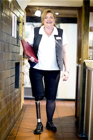 prosthesis - Portrait of mid adult woman with prosthetic leg Stock Photo - Premium Royalty-Free, Code: 649-08237708