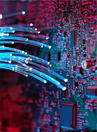 delicate electronics - Fibre optics flowing through circuit boards from a laptop computer, close-up Stock Photo - Premium Royalty-Free, Code: 649-08237900