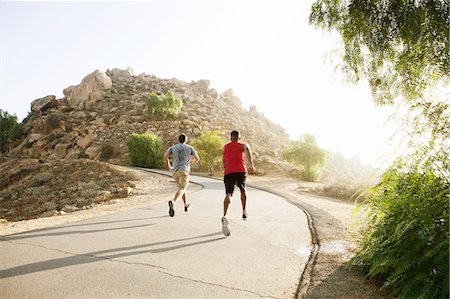 simsearch:649-06829432,k - Two male friends running along mountain path,rear view Stock Photo - Premium Royalty-Free, Code: 649-08238185