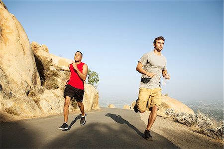 simsearch:649-06829432,k - Two male friends running along mountain path Stock Photo - Premium Royalty-Free, Code: 649-08238186