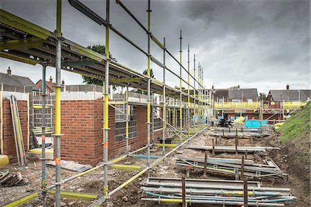 Scaffolding on building of construction site Stock Photo - Premium Royalty-Free, Code: 649-08238229
