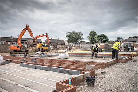 Workers laying bricks on construction site Stock Photo - Premium Royalty-Free, Code: 649-08238230