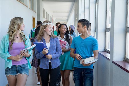 school corridor - Students walking down hallway, chatting Stock Photo - Premium Royalty-Free, Code: 649-08238282