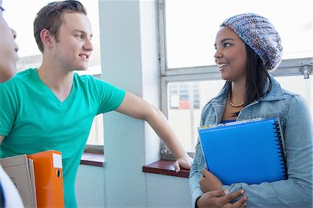 simsearch:632-01156768,k - Students standing by window, chatting Stock Photo - Premium Royalty-Free, Code: 649-08238305