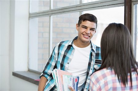 Students standing by window, chatting Stock Photo - Premium Royalty-Free, Code: 649-08238325