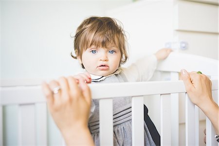 simsearch:649-07710656,k - Portrait of female toddler staring from crib Stock Photo - Premium Royalty-Free, Code: 649-08238411