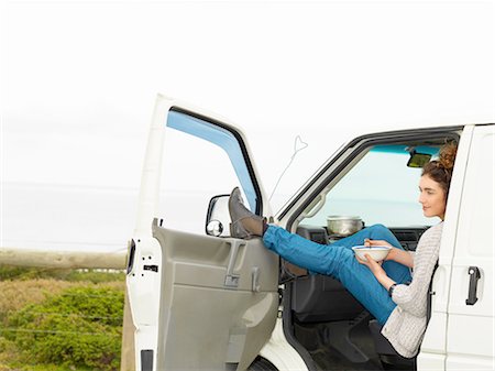 simsearch:862-08272896,k - Young woman eating breakfast cereal in camper van, Point Addis, Anglesea, Victoria, Australia Foto de stock - Sin royalties Premium, Código: 649-08238449