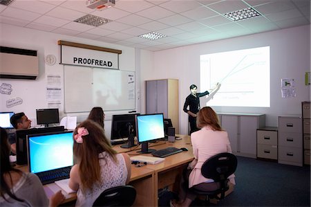 Computer teaching presenting in class Stock Photo - Premium Royalty-Free, Code: 649-08238571