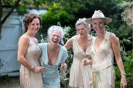 elegant and seniors - Elegant mature women enjoying champagne in urban garden Stock Photo - Premium Royalty-Free, Code: 649-08238928