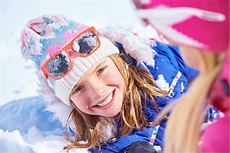 fallen on skis in snow - Mother and daughter playing in snow, Chamonix, France Stock Photo - Premium Royalty-Free, Code: 649-08232462