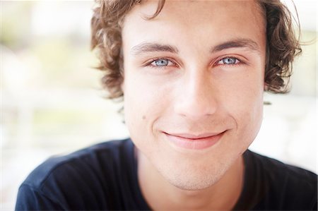 Close up portrait of young man with blue eyes Stock Photo - Premium Royalty-Free, Code: 649-08232709