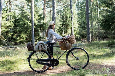 simsearch:649-08232809,k - Mature woman cyclist with foraging baskets on forest path Stock Photo - Premium Royalty-Free, Code: 649-08232807