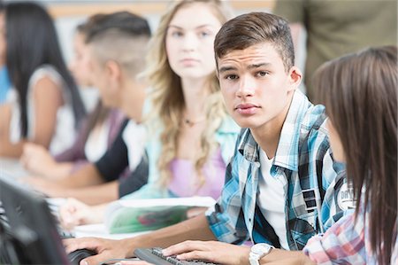 simsearch:649-07280106,k - Row of high school students doing schoolwork Stock Photo - Premium Royalty-Free, Code: 649-08306310