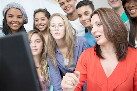 simsearch:614-09056539,k - Female teacher explaining on computer to high school students Stock Photo - Premium Royalty-Free, Code: 649-08306333