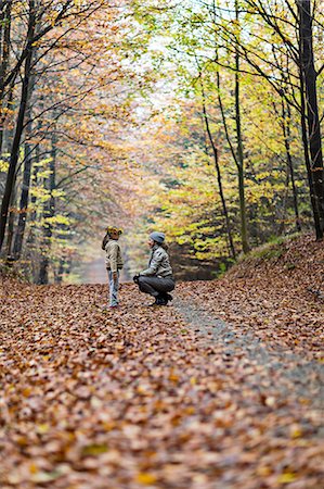 exploring - Mother and daughter in autumn forest Stock Photo - Premium Royalty-Free, Code: 649-08306778