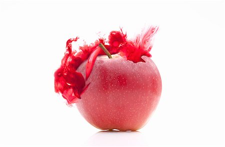 Red apple with corresponding coloured digital burst effect Stock Photo - Premium Royalty-Free, Code: 649-08306840