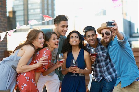 simsearch:614-06403067,k - Friends taking selfie at early evening party Stock Photo - Premium Royalty-Free, Code: 649-08306993