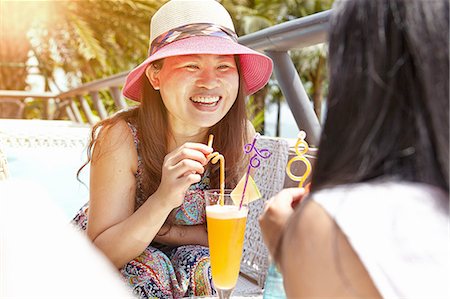 drinking soda in summer - Mid adult woman and daughter at beach cafe, Zhuhai, Guangdong, China Stock Photo - Premium Royalty-Free, Code: 649-08307187