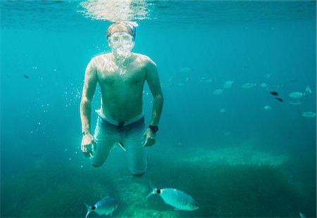 person nature not illustration and one person - Underwater view of mature man sea snorkeling, Menorca, Balearic islands, Spain Stock Photo - Premium Royalty-Free, Code: 649-08307500