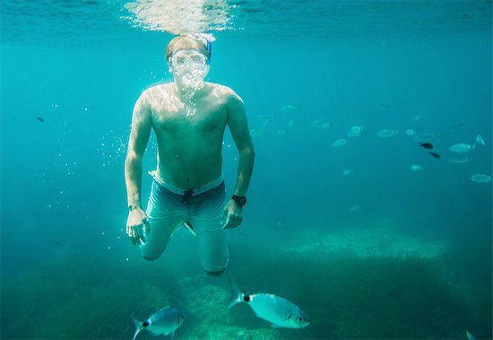 Underwater view of mature man sea snorkeling, Menorca, Balearic islands, Spain Photographie de stock - Premium Libres de Droits, Le code de l’image : 649-08307500