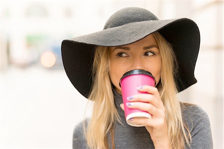 paper cup of coffee - Woman having coffee in street Stock Photo - Premium Royalty-Free, Code: 649-08327787