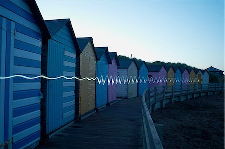 simsearch:649-08632720,k - Row of colourful beachhuts at dusk, with light trail, Bude, Cornwall, UK Stock Photo - Premium Royalty-Free, Code: 649-08327907