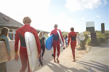 simsearch:649-02054536,k - Group of surfers, heading towards beach, carrying surfboards Stock Photo - Premium Royalty-Free, Code: 649-08327917