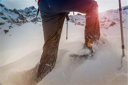 Climber wearing snow shoes walking through deep snow, Monte Rosa, Piedmont, Italy Stock Photo - Premium Royalty-Free, Code: 649-08328447