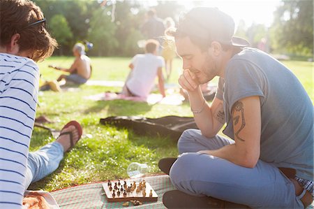 six - Young adults playing board game at sunset party in park Stock Photo - Premium Royalty-Free, Code: 649-08381097