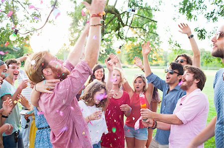 party and crowd - Adult crowd celebrating with arms raised at sunset party in park Stock Photo - Premium Royalty-Free, Code: 649-08381090