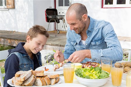 simsearch:649-08381240,k - Father and son at garden barbecue table Stock Photo - Premium Royalty-Free, Code: 649-08381249