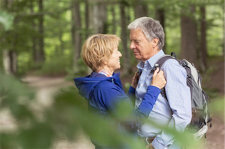 Couple standing face to face in forest Stock Photo - Premium Royalty-Free, Code: 649-08381576
