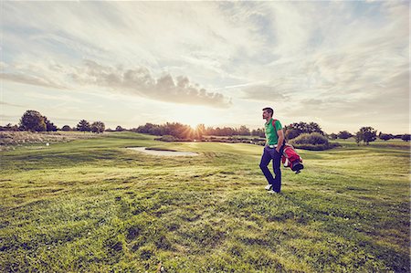 simsearch:649-08422474,k - Golfer walking on course, Korschenbroich, Dusseldorf, Germany Stock Photo - Premium Royalty-Free, Code: 649-08422472