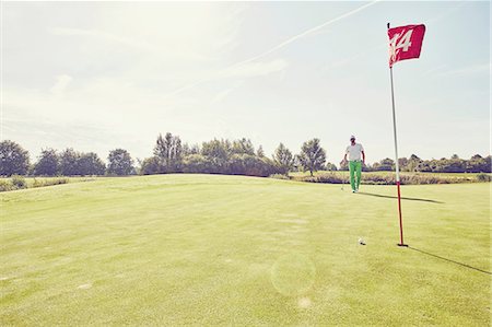 simsearch:649-08422474,k - Golfer playing golf, near 14th hole, Korschenbroich, Dusseldorf, Germany Stock Photo - Premium Royalty-Free, Code: 649-08422487