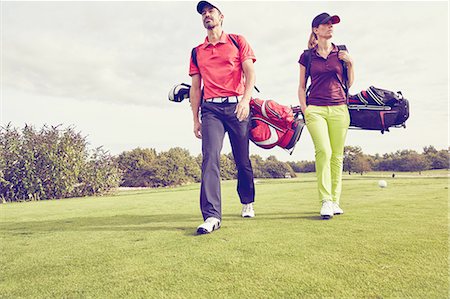 simsearch:649-08422474,k - Golfers walking on course, Korschenbroich, Dusseldorf, Germany Stock Photo - Premium Royalty-Free, Code: 649-08422482