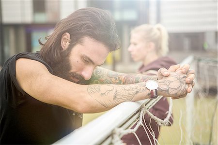 Mid adult man taking a break, leaning on football goal Stockbilder - Premium RF Lizenzfrei, Bildnummer: 649-08422759