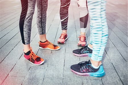 simsearch:649-08422865,k - Legs of three female runners standing on wooden pier Stock Photo - Premium Royalty-Free, Code: 649-08422872